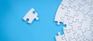 Photo of puzzle piece and round puzzle