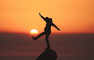 Image of person celebrating a sunrise