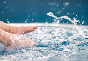 bare feet splashing in clear water for lifering blog